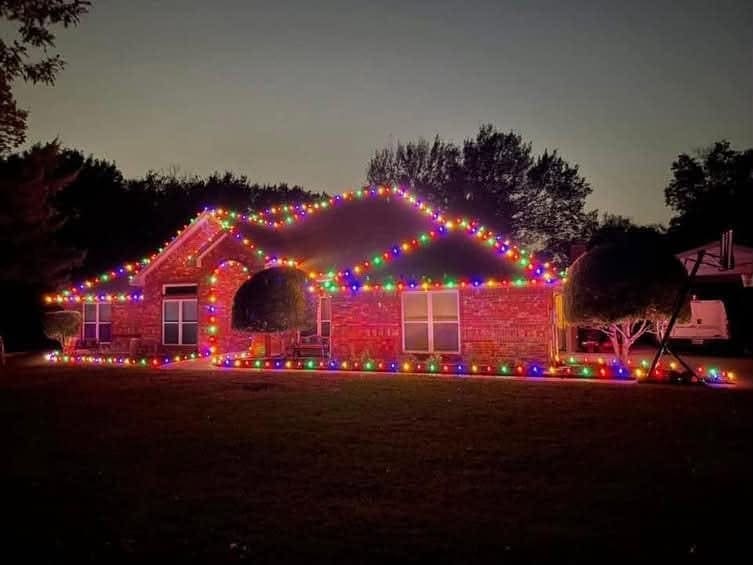 Multicolour roofline run with a wrapped tree out front